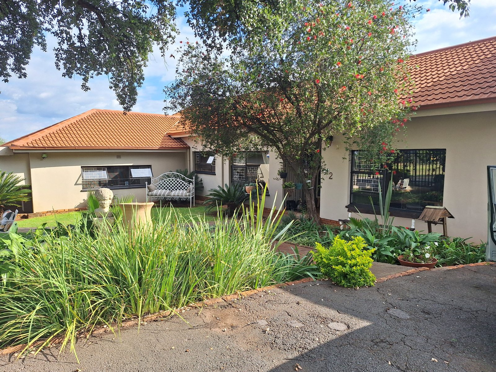 Fochville Guesthouse exterior with garden